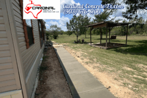 Connex container foundation and BBQ hut base with a smart raised design by Cardinal Concrete.